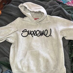 Supreme Raised Handstyle Hooded Sweatshirt
Ash Grey